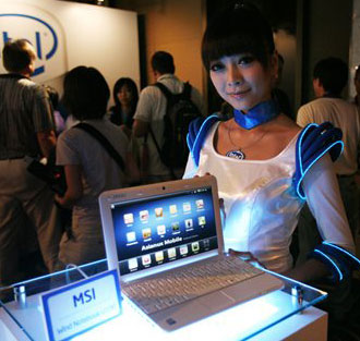 (Photo, courtesy of the Associated Press, by Wally Santana) A model displays a MSI laptop containing Intel Corporations new Atom chip at Computex Taipei, the biggest information technology trade show in Asia, in Taipei, Taiwan, Tuesday, June 3, 2008.